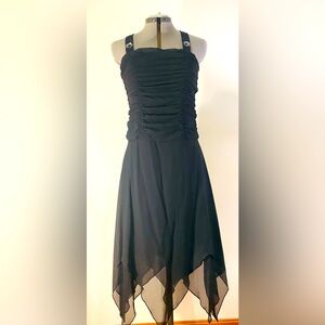 Black dress with asymmetrical hemline and beaded straps. Size M